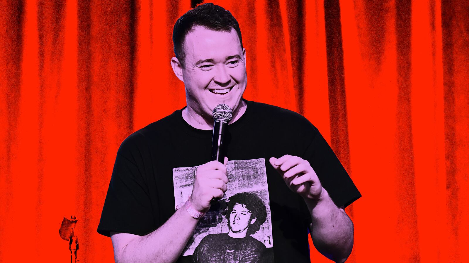 Photo illustration of Shane Gillis performing standup with a red background.