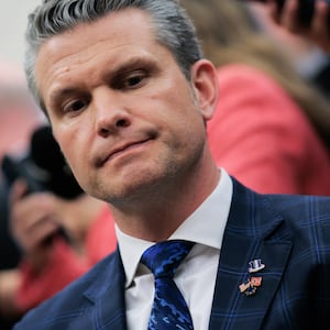 A close-up of Pete Hegseth at a meeting in the Oval Office.