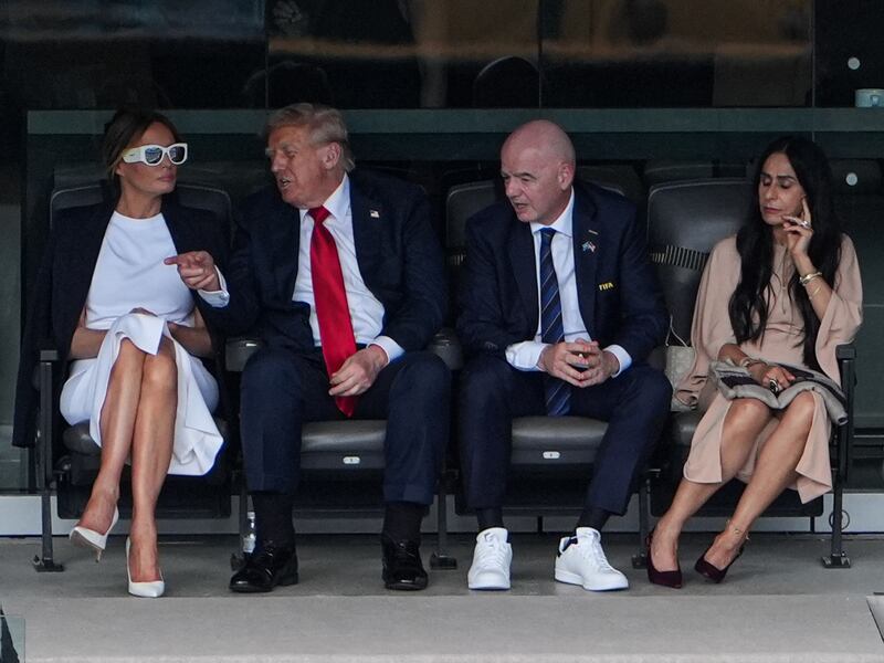 President Donald Trump seated with First Lady Melania Trump, FIFA President Gianni Infantino, and his wife Leena Al Ashqar at the FIFA Club World Cup 2025 Final match on July 13, 2025 in New Jersey.
