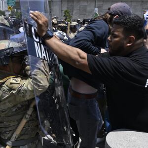 National guards confront with protesters outside of the Metropolitan Detention Center in Los Angeles.