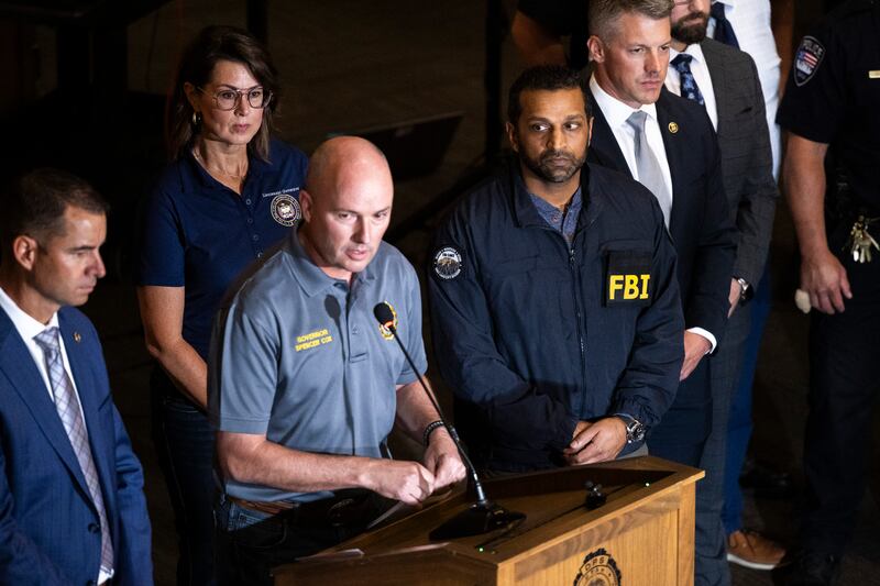 OREM, UTAH - SEPTEMBER 11: Governor of Utah Spencer Cox speaks at a press conference flanked by FBI director Kash Patel, Lieutenant Governor of Utah Deidre Henderson, and Commissioner Beau Mason following the fatal shooting of political activist Charlie Kirk during an event at Utah Valley University on September 11, 2025 in Orem, Utah.
