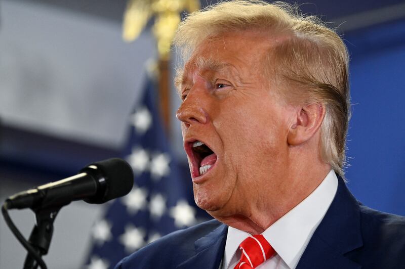 Former President Donald Trump campaigns in Newton, Iowa.