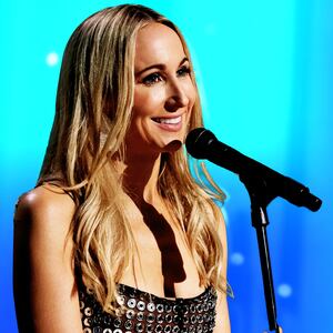 An illustration including a photo of Nikki Glaser
