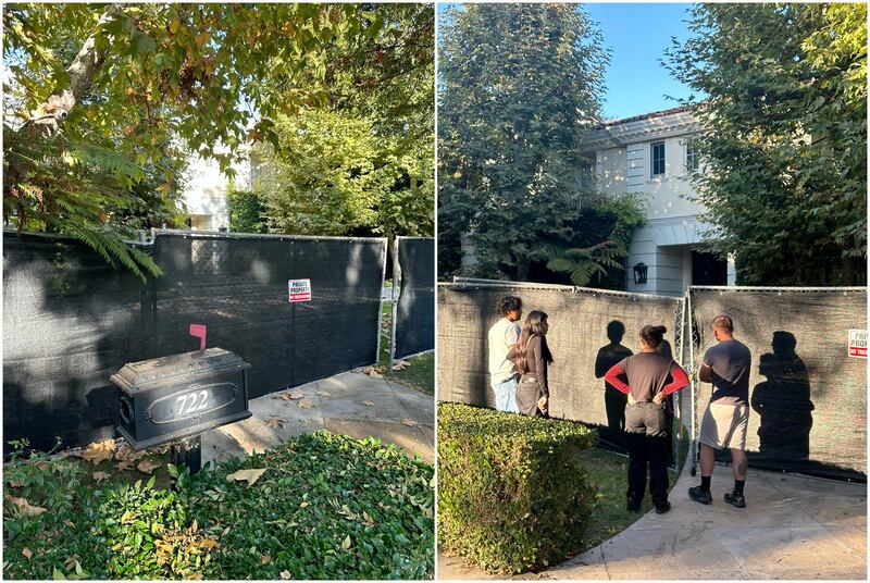 Visitors stand outside the former Menendez family home in Beverly Hills, California.