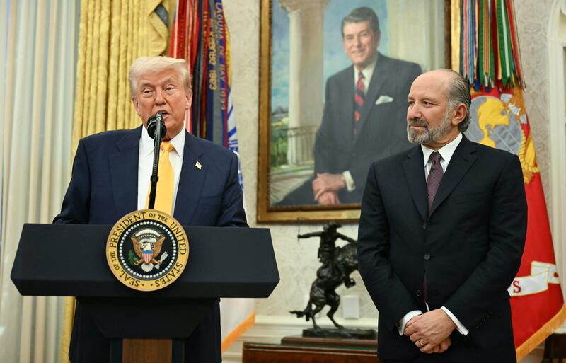 US President Donald Trump speaks during a ceremonial swearing-in for US Secretary of Commerce Howard Lutnick (R) in the Oval Office of the White House in Washington, DC, on February 21, 2025.