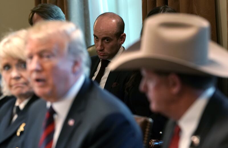Stephen Miller (C) looks on as U.S. President Donald Trump hosts a round-table discussion on border security in the Cabinet Room of the White House on January 11, 2019 in Washington, DC.