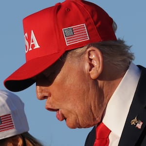 JOINT BASE ANDREWS, MARYLAND - OCTOBER 05: U.S. President Donald Trump and first lady Melania Trump disembark Air Force One after a visit to the USS George H.W. Bush aircraft carrier on October 05, 2025 in Joint Base Andrews, Maryland. Trump is visiting Naval Station Norfolk in Virginia for a celebration of the 250th anniversary of the U.S. Navy.  (Photo by Alex Wong/Getty Images)