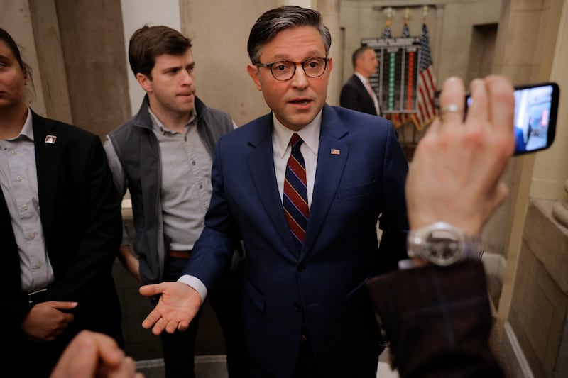 WASHINGTON, DC - OCTOBER 28: Speaker of the House Mike Johnson (R-LA) talks with reporters in the hallway outside his office following a news conference on the 28th day of the federal government shutdown at the U.S. Capitol on October 28, 2025 in Washington, DC. While keeping the House of Representatives out of session and away from Washington, Republican leaders blamed Democratic lawmakers for the continued federal government shutdown. (Photo by Chip Somodevilla/Getty Images)