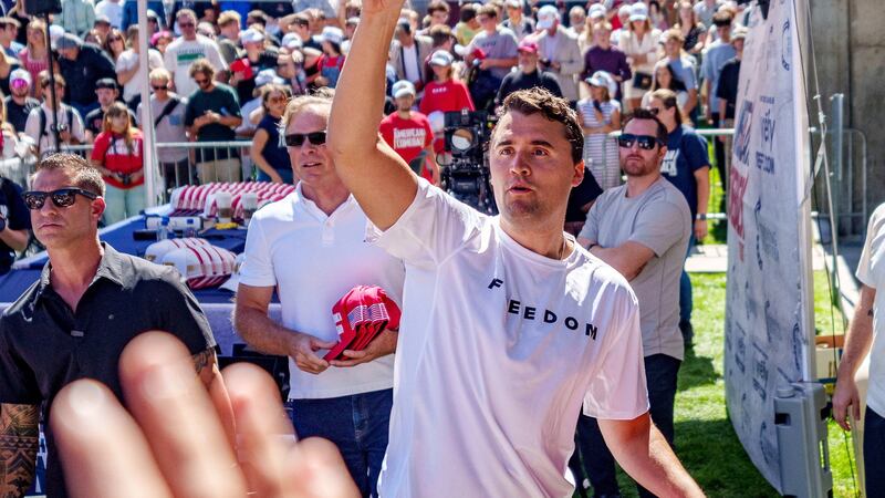 Right-wing activist and commentator Charlie Kirk throws hats to the crowd shortly before he was shot at a Utah Valley University speaking event in Orem, Utah, Sept. 10, 2025.