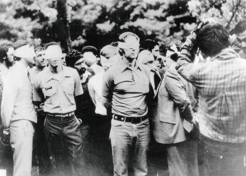 Americans blindfolded on first day of Iran crisis.
