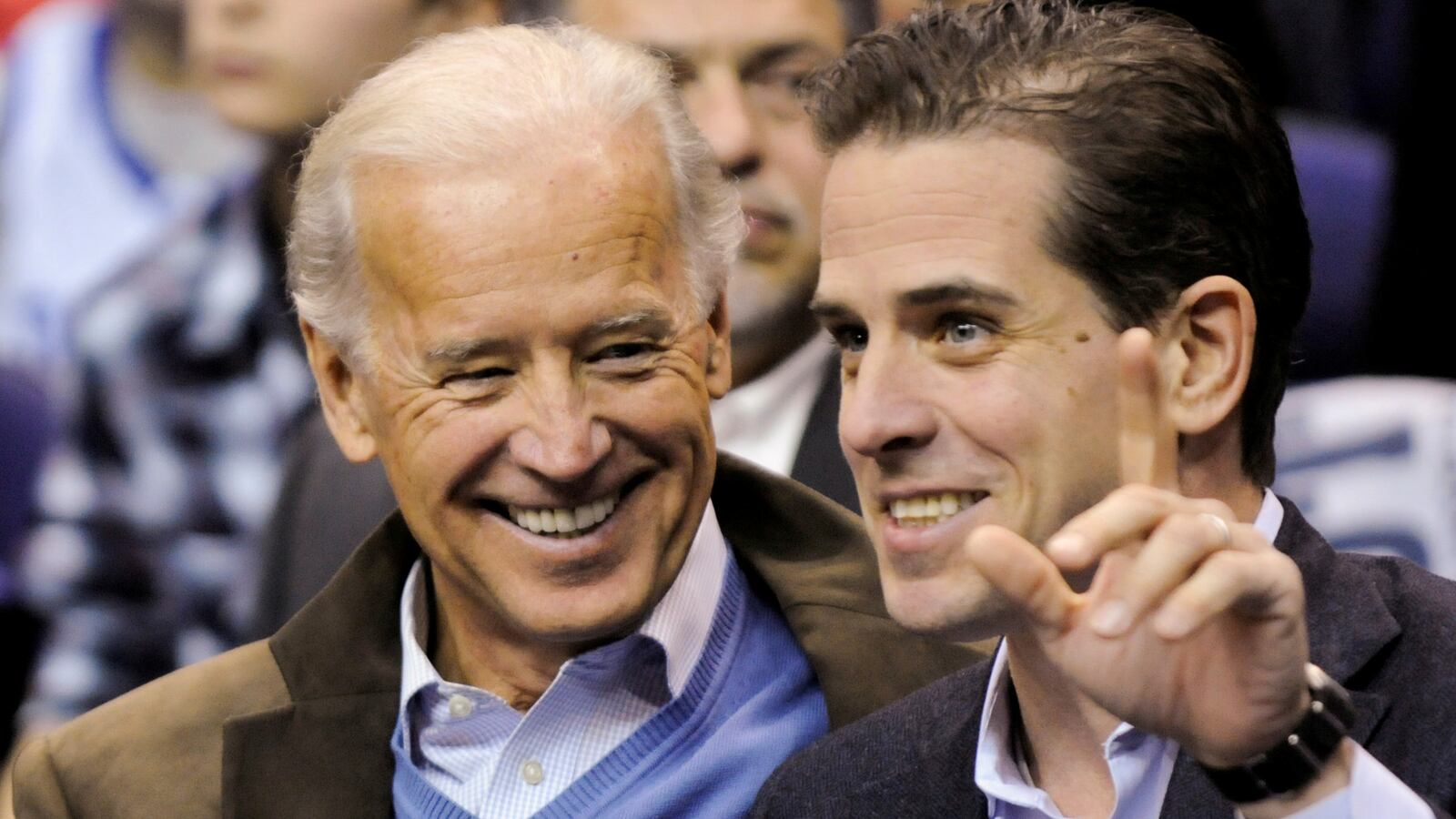 Then-U.S. Vice President Joe Biden and his son, Hunter Biden, attend an NCAA basketball game between Georgetown University and Duke University in Washington, U.S., January 30, 2010.