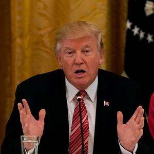 U.S. President Donald Trump meets with Senate Republicans at the White House on June 27, 2017. Trump is flanked by Senators Susan Collins (R-ME) and Sen. Lisa Murkowski (R-AK).