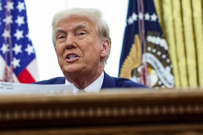 President Donald Trump speaks while signing executive orders in the White House Oval Office on  February 13, 2025.