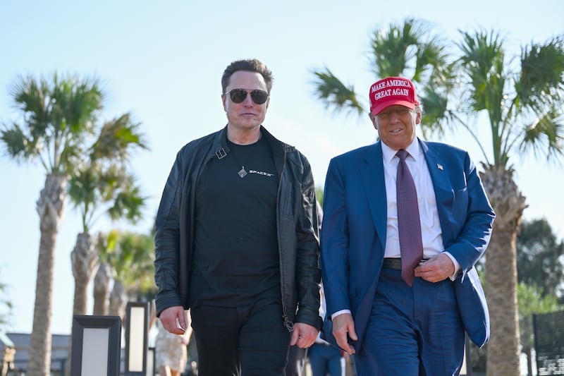 U.S. President Donald Trump greets Elon Musk as he arrives to attend a viewing of the launch of the sixth test flight of the SpaceX Starship rocket on November 19, 2024 in Brownsville, Texas.