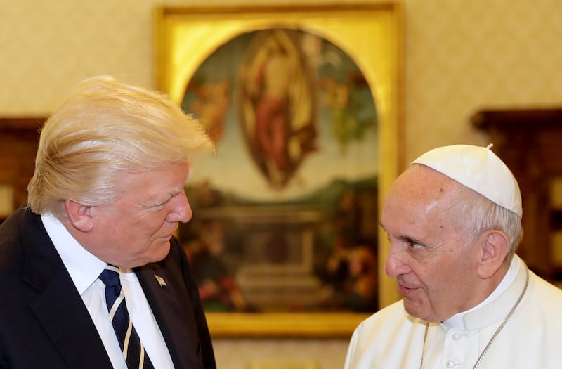 Pope Francis talks with President Donald Trump during a private audience at the Vatican, May 24, 2017.