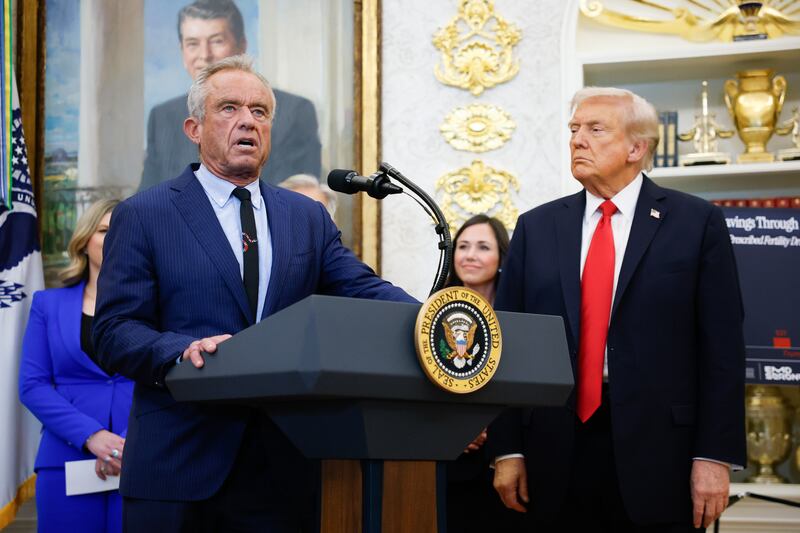 WASHINGTON, DC - OCTOBER 16: Secretary of Health and Human Services Robert F. Kennedy Jr. delivers remarks as U.S. President Donald Trump looks on during an event in the Oval Office of the White House on October 16, 2025 in Washington, DC. U.S. President Donald Trump outlined plans during the event to expand vitro fertilization (IVF) access by encouraging workplace benefits to include access to IVF and infertility coverage. (Photo by Kevin Dietsch/Getty Images)