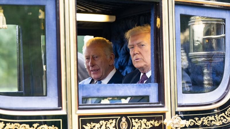 King Charles III and U.S. President Donald Trump in a carriage during the carriage procession during the State visit by the President of the United States of America at Windsor Castle on September 17, 2025 in Windsor, England.