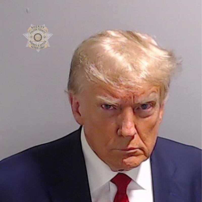 A photo including a mugshot of Former US President Donald Trump