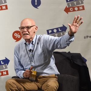 James Carville waves to the audience during a speaking engagement.