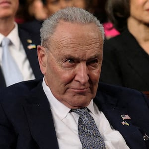 Senate Minority Leader Chuck Schumer (D-NY) listens as U.S. President Donald Trump addresses a joint session of Congress at the U.S. Capitol.