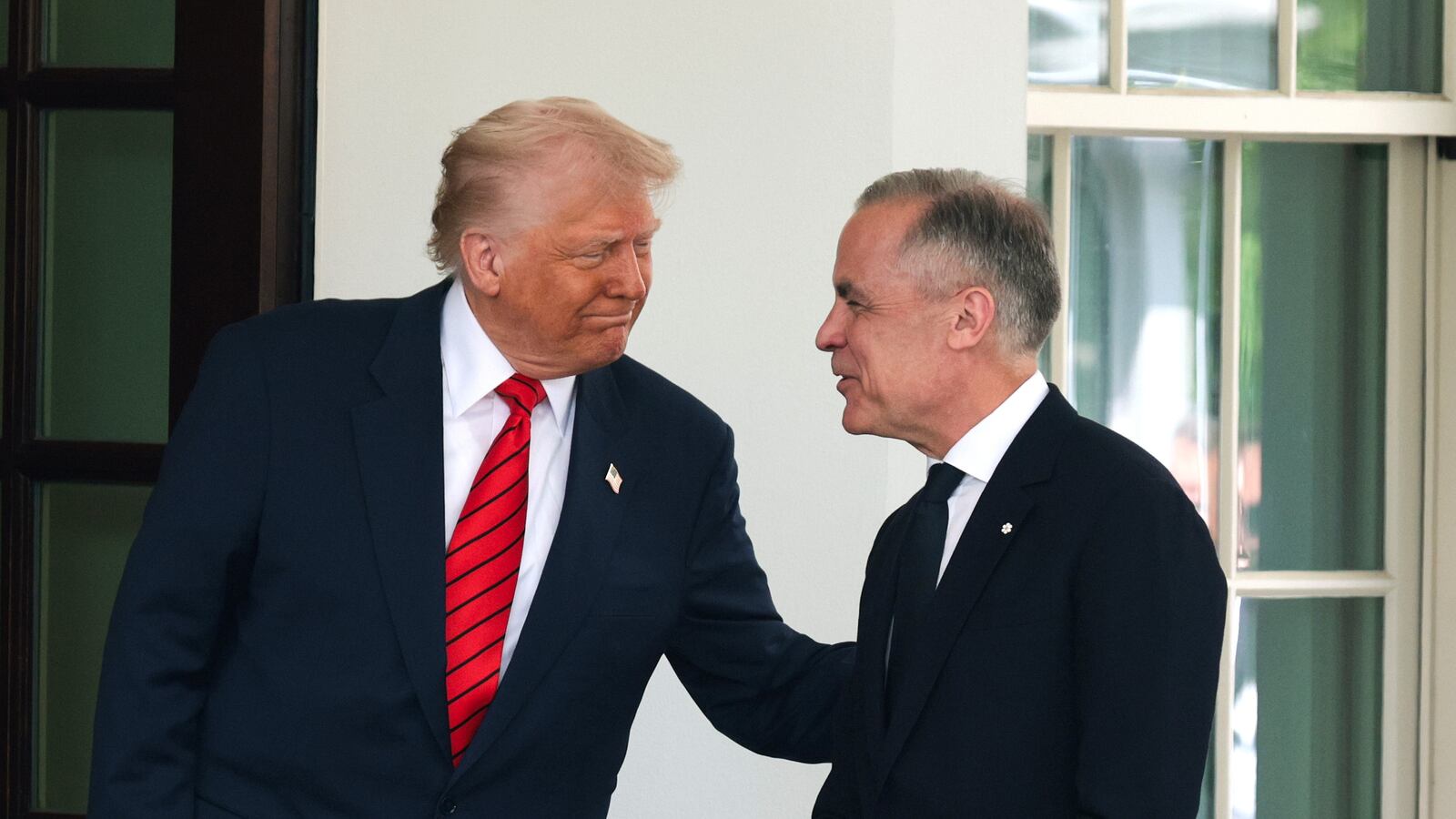 President Donald Trump greets Canadian Prime Minister Mark Carney as he arrives at the West Wing of the White House on May 6, 2025 in Washington, DC. Carney, who was elected into office last week, is expected to meet with President Trump to discuss trade and the recent tariffs imposed on Canada.