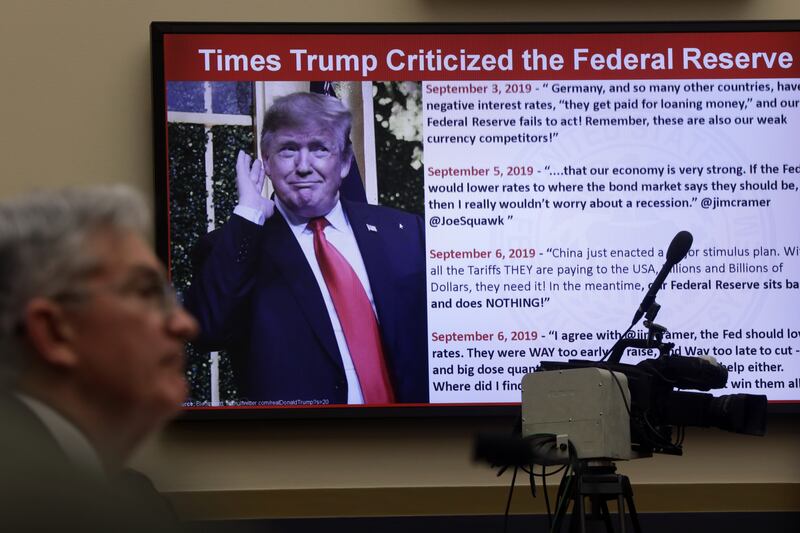 Federal Reserve Board Chairman Jerome Powell testifies as a photo of U.S. President Donald Trump is shown on a screen during a hearing before House Financial Services Committee February 11, 2020 on Capitol Hill in Washington,