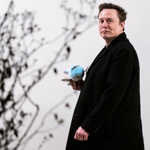 Elon Musk carries a stuffed Air Force One as he walks back to the West Wing along the colonnade after returning to the White House on Marine One with President Donald Trump on Wednesday, Feb 19, 2025 in Washington, DC.