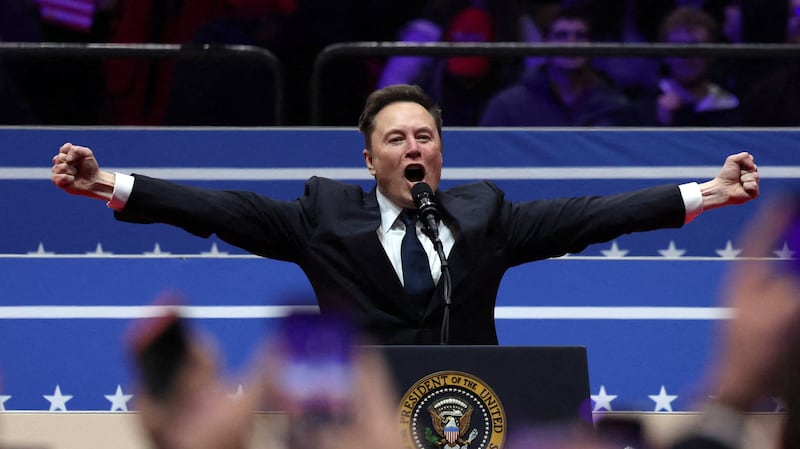 Elon Musk gestures as he speaks inside the Capital One arena on the inauguration day of Donald Trump's second presidential term, in Washington, U.S., January 20, 2025. REUTERS/Amanda Perobelli