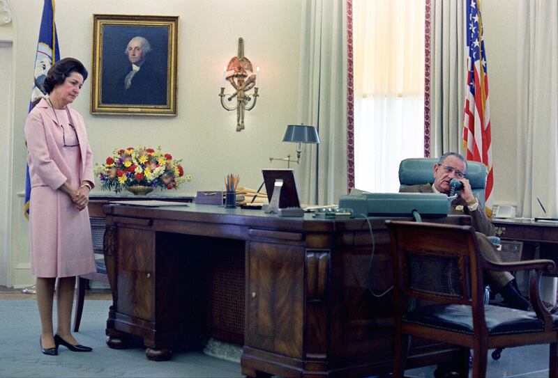 First Lady Claudia "Lady Bird" Johnson looks on as President Lyndon B. Johnson telephones the Kennedys after Robert F. Kennedy's assassination in 1968. (Photo by: GHI/Universal History Archive/Universal Images Group via Getty Images)