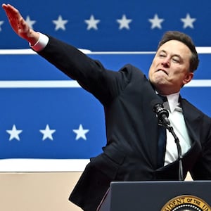 TOPSHOT - Tesla and SpaceX CEO Elon Musk gestures as he speaks during the inaugural parade inside Capitol One Arena, in Washington, DC, on January 20, 2025. (Photo by ANGELA WEISS / AFP) (Photo by ANGELA WEISS/AFP via Getty Images)