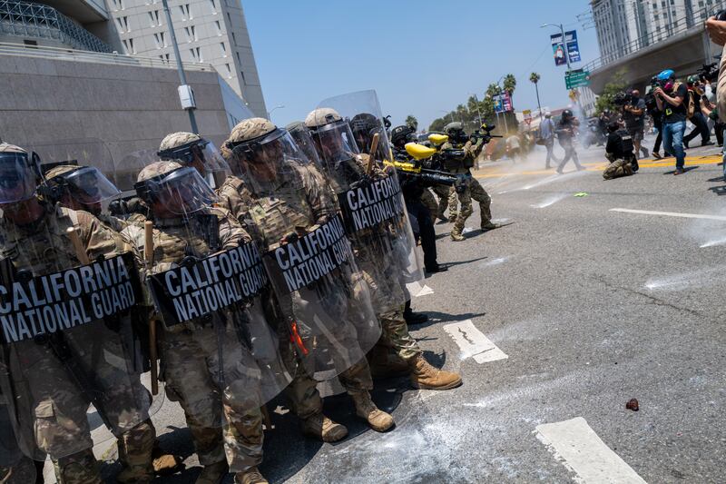 LOS ANGELES, CALIFORNIA - JUNE 08: Demonstrators protest outside a downtown jail in Los Angeles following two days of clashes with police during a series of immigration raids on June 08, 2025 in Los Angeles, California. Tensions in the city remain high after the Trump administration called in the National Guard against the wishes of city leaders. (Photo by Spencer Platt/Getty Images)