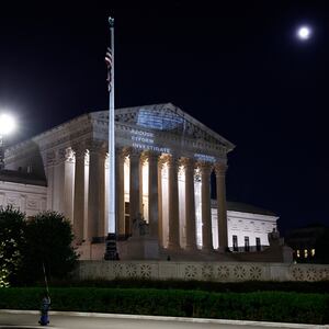 Demand Justice projects \"Stop The Steal\" upside down American flag on the U.S. Supreme Court to call attention to Justice Alito's alleged actions on May 21, 2024 in Washington, DC. 