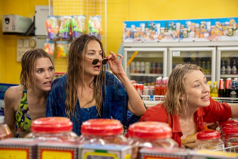 Three women in a grocery store.