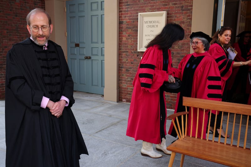 Interim president Alan Garber waits for the the honorary degree recipients to assemble for a group photograph before the 373rd Commencement Exercises at Harvard University in Cambridge, Massachusetts, U.S., May 23, 2024.  REUTERS/Brian Snyder