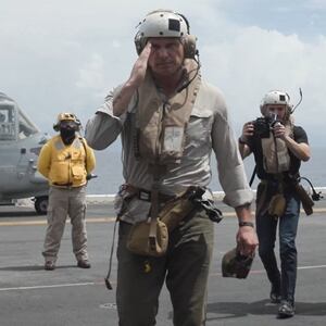 Pete Hegseth salutes aboard the USS Iwo Jima.
