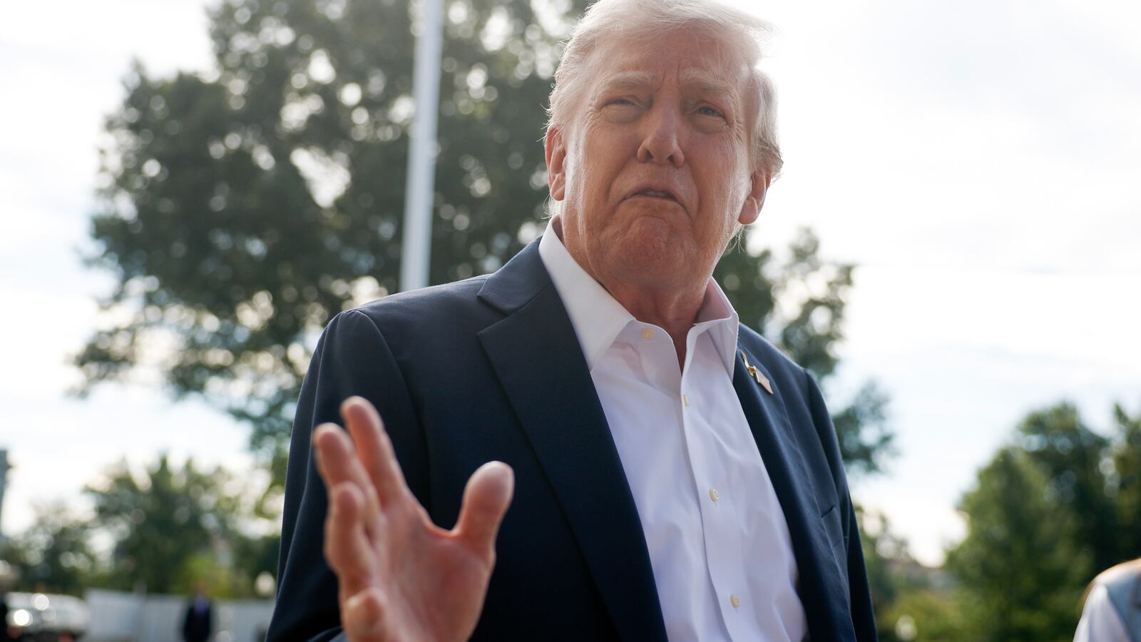 President Donald Trump speaks to members of the media as he departs the White House on September 26, 2025 in Washington, DC.