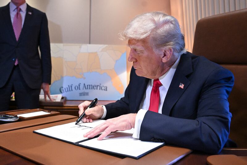 President Donald Trump signs a proclamation renaming the Gulf of Mexico as the Gulf of America aboard Air Force One enroute to New Orleans, Louisiana on Febrary 09, 2025.