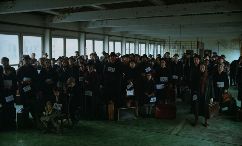 Immigrants arrive at Ellis Island in The Brutalist.