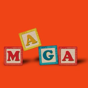 School children wood blocks spelling out MAGA on a red background