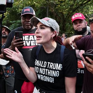 Laura Loomer speals demonstrators on August 24, 2023, near the entrance of the Fulton County Jail as former President Donald Trump prepared to turn himself in to be processed after being indicted in Atlanta, Georgia.