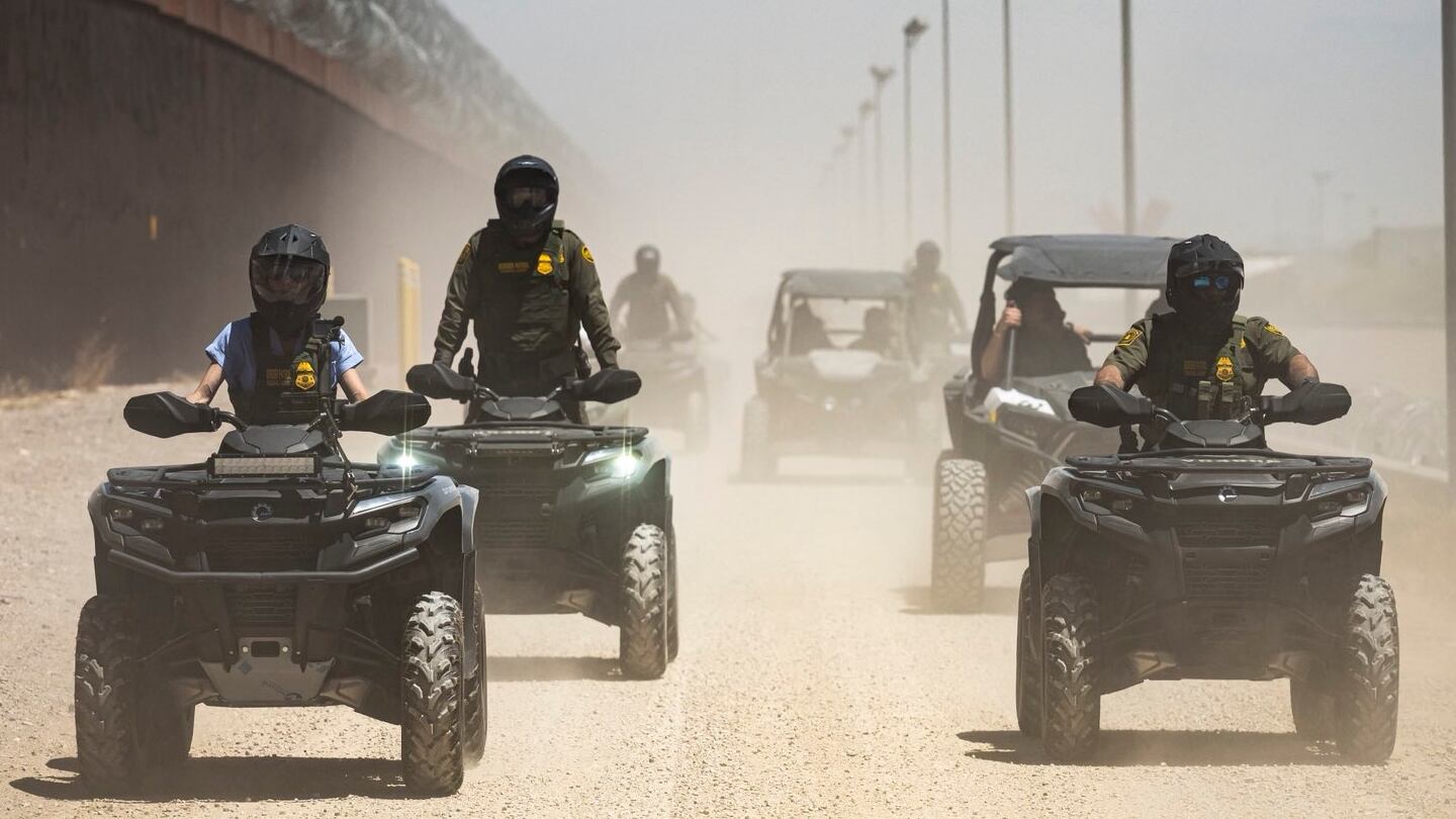Homeland Security Secretary Kristi Noem rides an ATV along the U.S.-Mexico border.