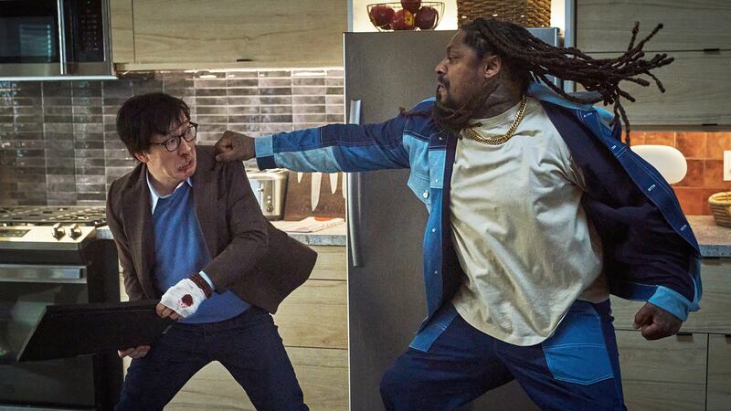 Ke Huy Quan and Marshawn Lynch in Love Hurts.