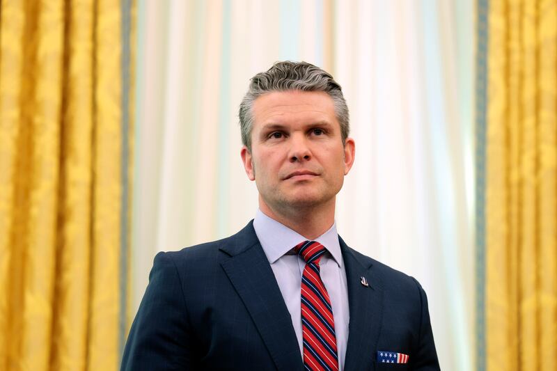 U.S. Secretary of Defense Peter Hegseth listens as U.S. President Donald Trump delivers remarks in the Oval Office of the White House on March 21, 2025 in Washington, DC.