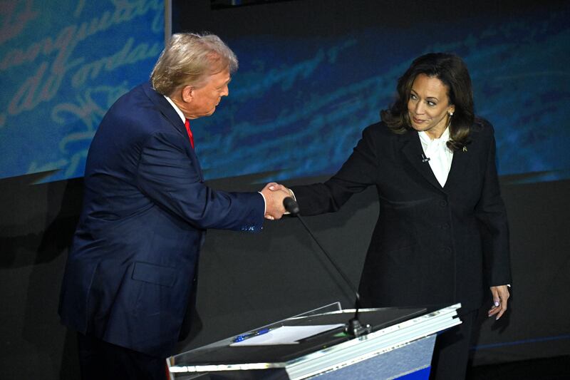 Kamala Harris (R) shakes hands with  Donald Trump (L) during a presidential debate at the National Constitution Center in Philadelphia, Pennsylvania, on September 10, 2024.