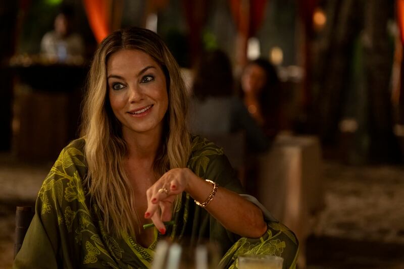 A woman at a dining table.