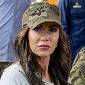 Department of Homeland Security Secretary Kristi Noem speaks with U.S. Coast Guard Rear Admiral Joseph Buzzella in San Diego.