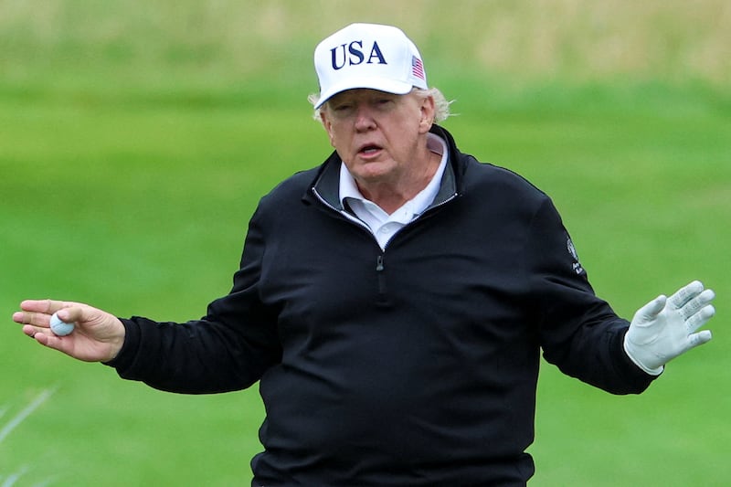 U.S. President Donald Trump holds a golf ball at Trump Turnberry resort in Turnberry, Scotland, Britain, July 27, 2025. REUTERS/Phil Noble