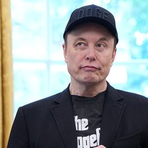 Elon Musk, sporting a black eye given to him by his son X, listens as President Donald Trump speaks to reporters in the Oval Office of the White House on May 30, 2025.