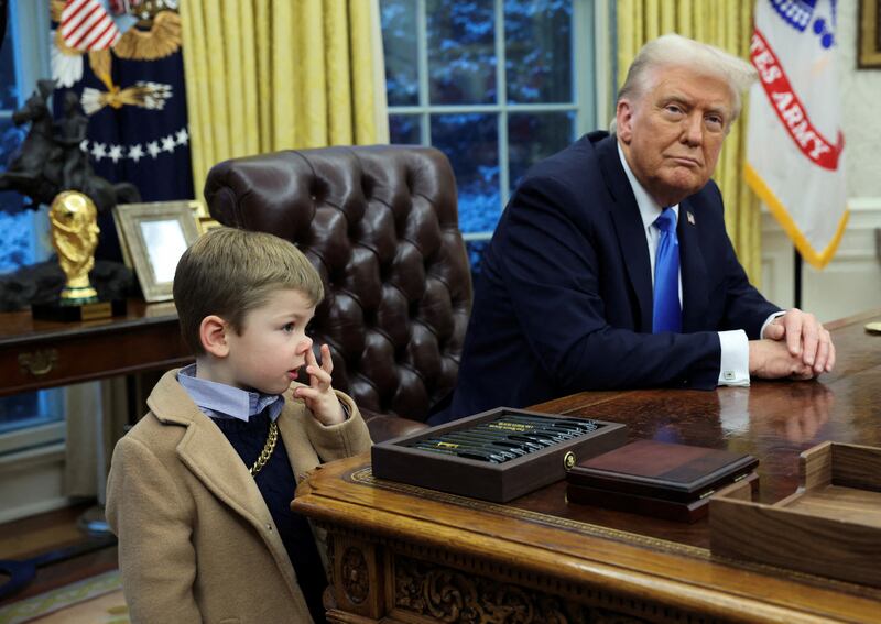 U.S. President Donald Trump looks on as X Æ A-12, Elon Musk's son, stands beside him in the Oval Office of the White House in Washington, D.C., U.S., February 11, 2025.