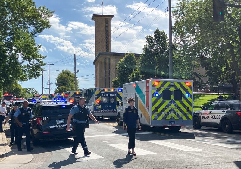 Police and first responders work at the scene of a shooting near Annunciation Church and Catholic School in Minneapolis, Minneosta, on Aug. 27, 2025. Two children were shot dead when a gunman attacked a Minneapolis church on Wednesday, with 17 people injured, 14 of them children, police said. The gunman "began firing a rifle through the church windows towards the children sitting in the pews at the mass," Minneapolis police chief Brian O'Hara told reporters. The pupils were marking the first week of the school year when the attack occurred.